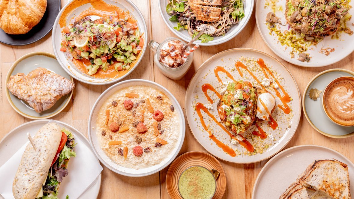 Overhead spread of brunch dishes on a table