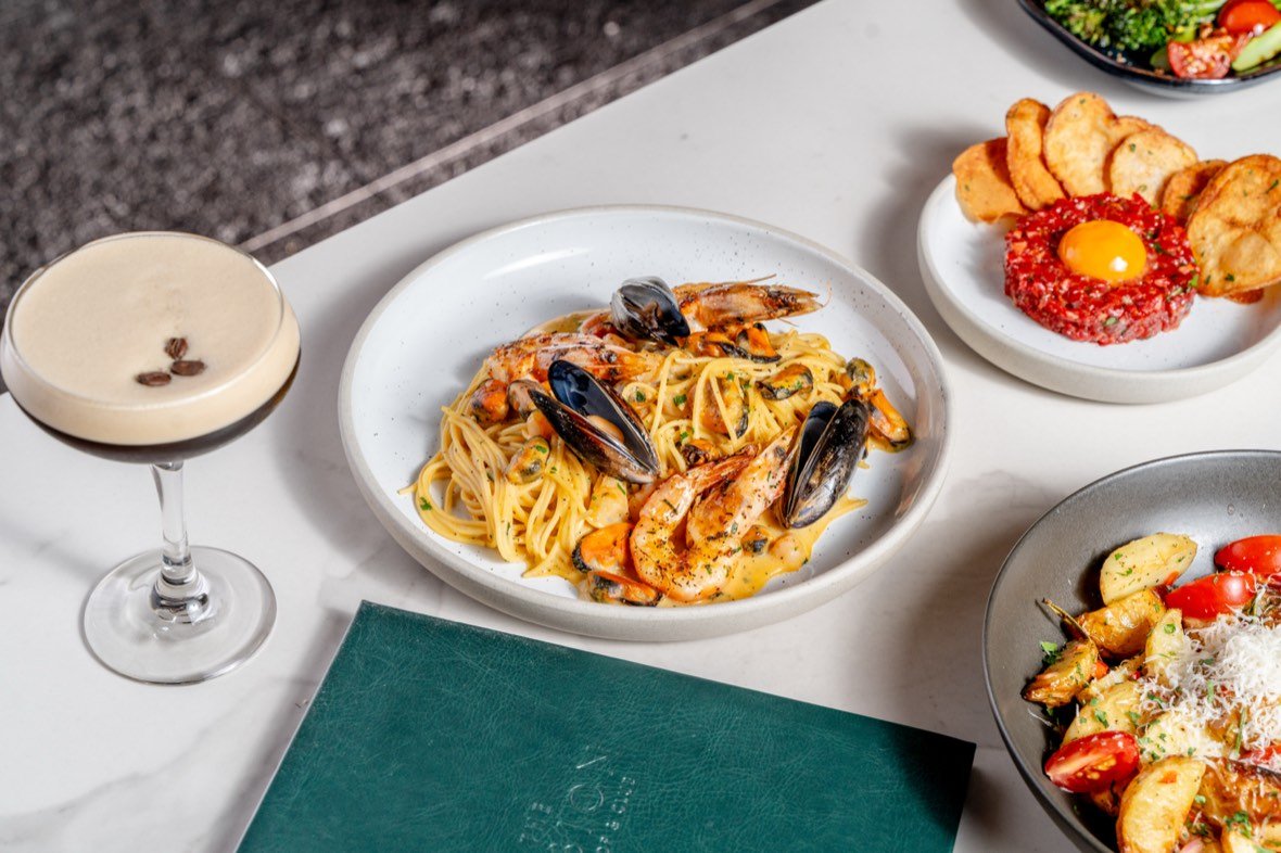 Seafood pasta with a glass of wine